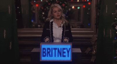 Woman Behind Podium Saying Britney GIF