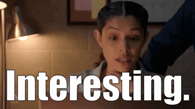 Woman Behind Sign Saying Interesting GIF