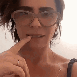 Woman Biting Glasses Nervously GIF