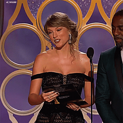 Woman Black Dress At Microphone, Man Green Suit GIF