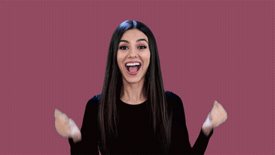 Woman Black Shirt Arms Up Smiling GIF