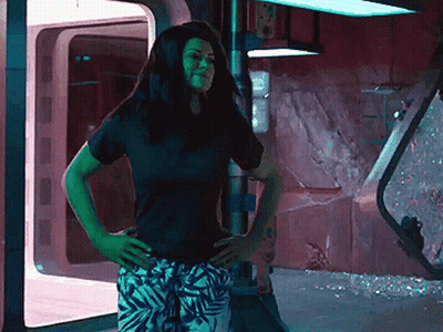 Woman Black Shirt White Pants Hands On Hips GIF