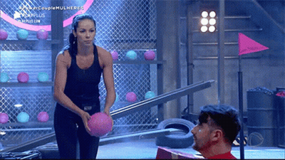Woman Black Top Holding Pink Ball Beside Man GIF