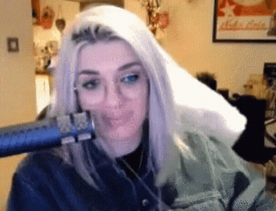 Woman Blow Drying Hair In Front Of Nuka Cola Poster GIF