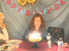 Woman Blowing Birthday Candles And Cheering