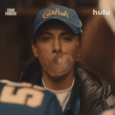 Woman Blowing Bubble With Catfish Hat GIF