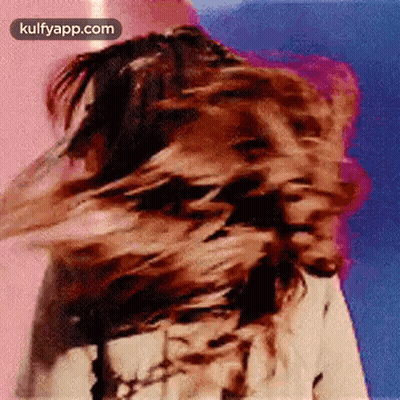 Woman Blowing Hair In Wind GIF