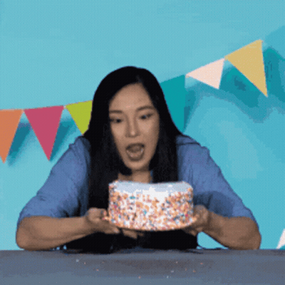 Woman Blowing Out Birthday Candle GIF