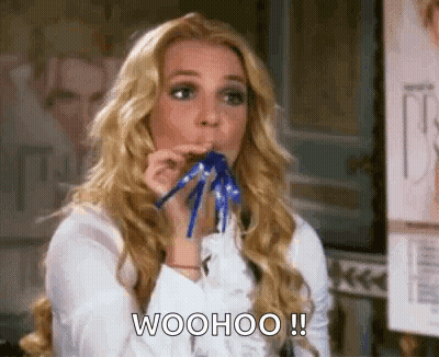 Woman Blowing Party Horn Saying Woohoo GIF