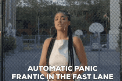 Woman By Chain Link Fence With Automatic Panic Frantic In Fast Lane GIF