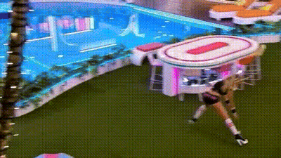 Woman By Pink And White Table In Pool Area GIF