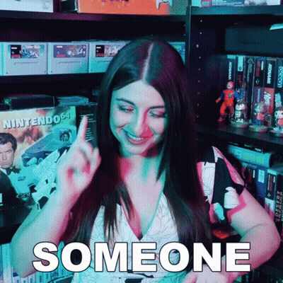 Woman By Shelf With Nintendo Box GIF