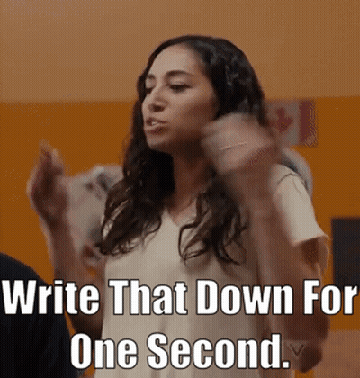 Woman By Sign Saying Write That Down For One Second GIF