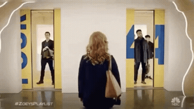 Woman By Two Elevators With Number 4 GIF