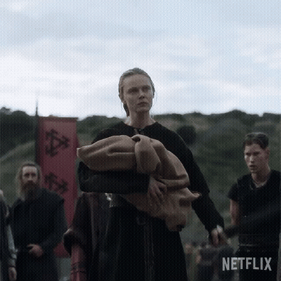 Woman Carrying Blanket In Front Of Netflix Banner GIF