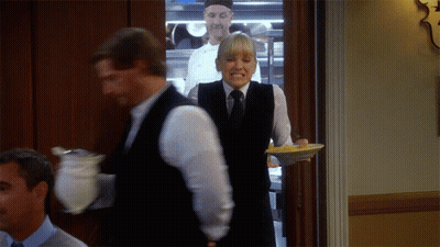 Woman Carrying Plate Of Food Man Holding Bowl GIF