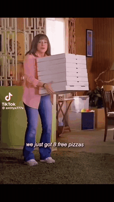 Woman Carrying Stack Of Pizza Boxes GIF