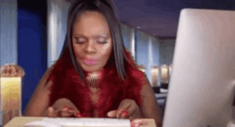Woman Chewing While Typing On Keyboard GIF