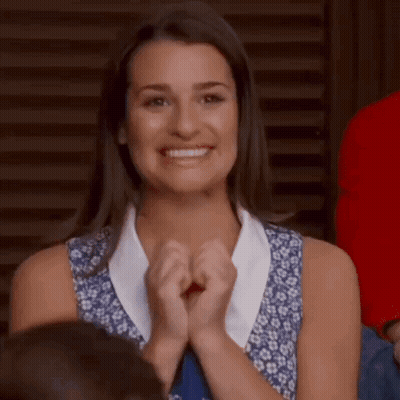 Woman Clapping And Smiling In Crowd GIF