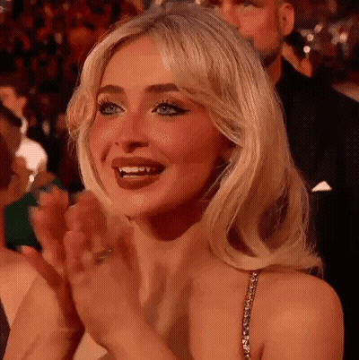 Woman Clapping In Crowd At Party GIF