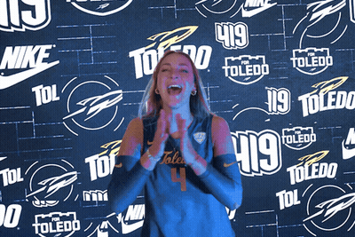 Woman Clapping In Front Of Nike Toledo Wall GIF