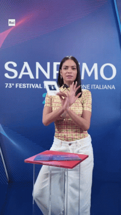 Woman Clapping In Front Of Sanremo 73 Festival Sign GIF