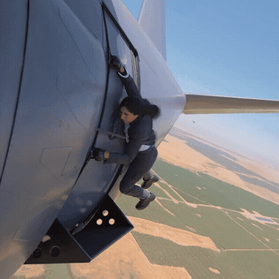 Woman Climbing Out Of Plane Door GIF