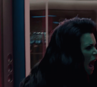 Woman Close Up In Dark Room GIF