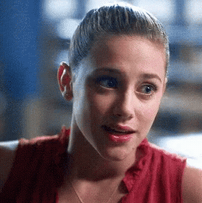 Woman Close Up In Red Shirt With Ponytail GIF