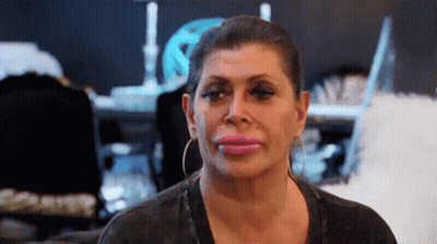 Woman Close Up Pink Lips And Earrings GIF