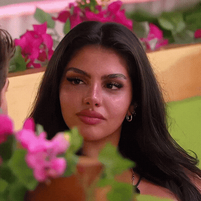 Woman Close Up With Flowers And Man GIF