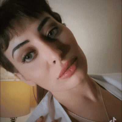 Woman Close-Up With Letter T GIF