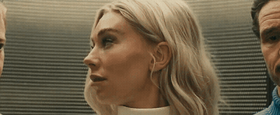 Woman Close Up With Man Behind GIF