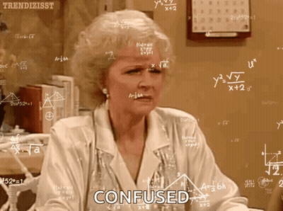 Woman Confused At Chalkboard With Equations GIF