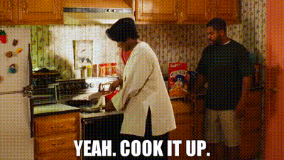 Woman Cooking In Kitchen Man Saying Yeah Cook It Up GIF