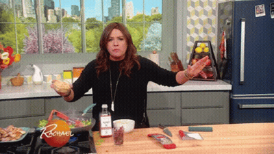 Woman Cooking In Kitchen With Rachael On Orange GIF