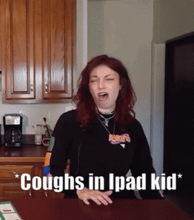 Woman Coughs In Kitchen Saying Coughs In Ipad Kid GIF