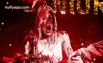 Woman Covered In Blood Holding Knife GIF