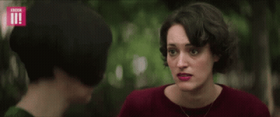 Woman Covering Ears As Another Looks GIF