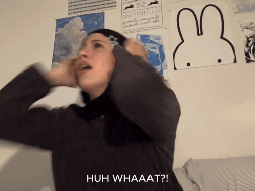 Woman Covering Ears With Huh Whaaat GIF