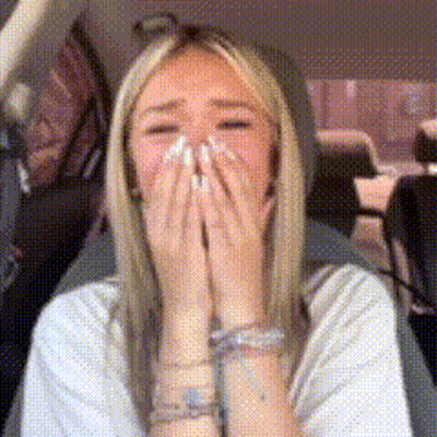 Woman Covering Face In Car GIF
