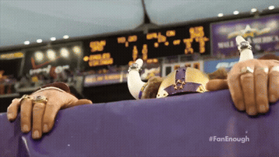 Woman Covering Face In Front Of Crowd GIF