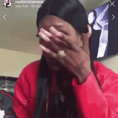 Woman Covering Face In Red Jacket GIF