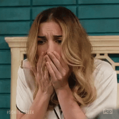 Woman Covering Face On Bench GIF