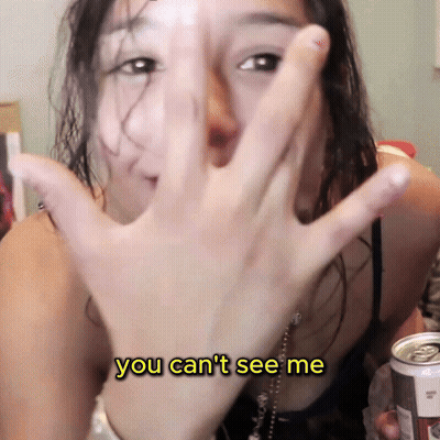 Woman Covering Face Saying You Can't See Me