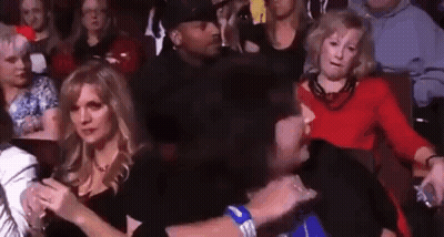 Woman Covering Face While Holding Phone GIF