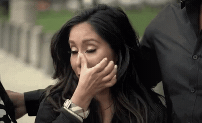Woman Covering Face While Man Holds Her GIF