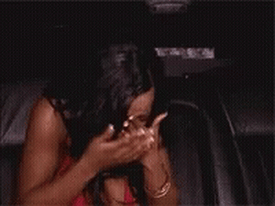 Woman Covering Face While Sitting In Car GIF