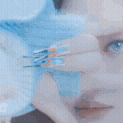 Woman Covering Face With Blue Glove GIF
