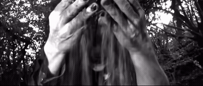 Woman Covering Face With Hands In Black And White Photo GIF